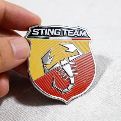 Custom Clothing Patches made with woven fabric and ink featuring customizable sizes shapes and pantone colors for apparel accessories