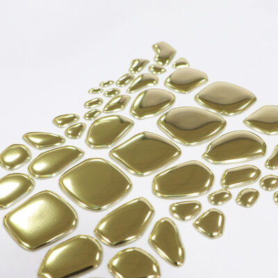 फैक्टरी कस्टम धातु स्वर्ण टीपीयू हीट ट्रांसफर लेबल - लक्जरी परिधान और फैशन वस्त्रों के लिए अनियमित आकार का प्रतीक